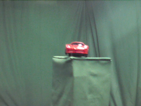135 Degrees _ Picture 9 _ Red Toy Sportscar.png